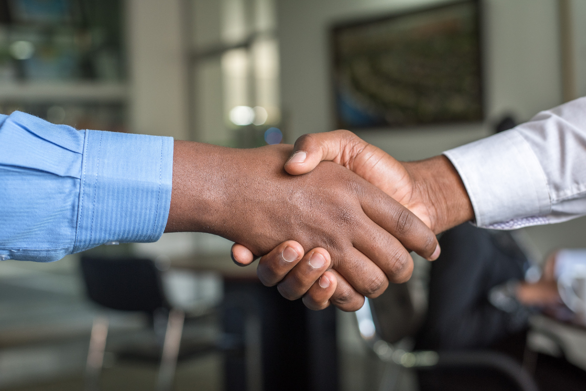 Team Members: Two hands meeting in the center to shake